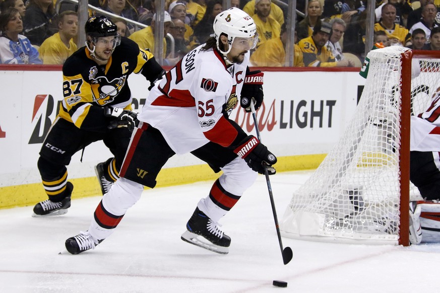 FILE - In this May 13, 2017, file photo, Ottawa Senators&#039; Erik Karlsson (65) and Pittsburgh Penguins&#039; Sidney Crosby (87) play during the second period of Game 1 of the Eastern Conference fin ...