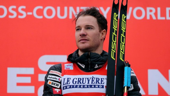 Switzerland&#039;s Dario Cologna poses on the podium after winning a cross-country ski men&#039;s 9 km Final Climb Pursuit race, at the FIS Tour de Ski event in Val di Fiemme, Italy, Sunday, Jan. 7, 2 ...