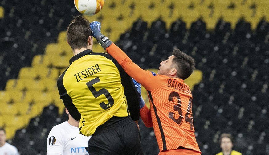 YB&#039;s Cedric Zesiger, left,in action against Cluj