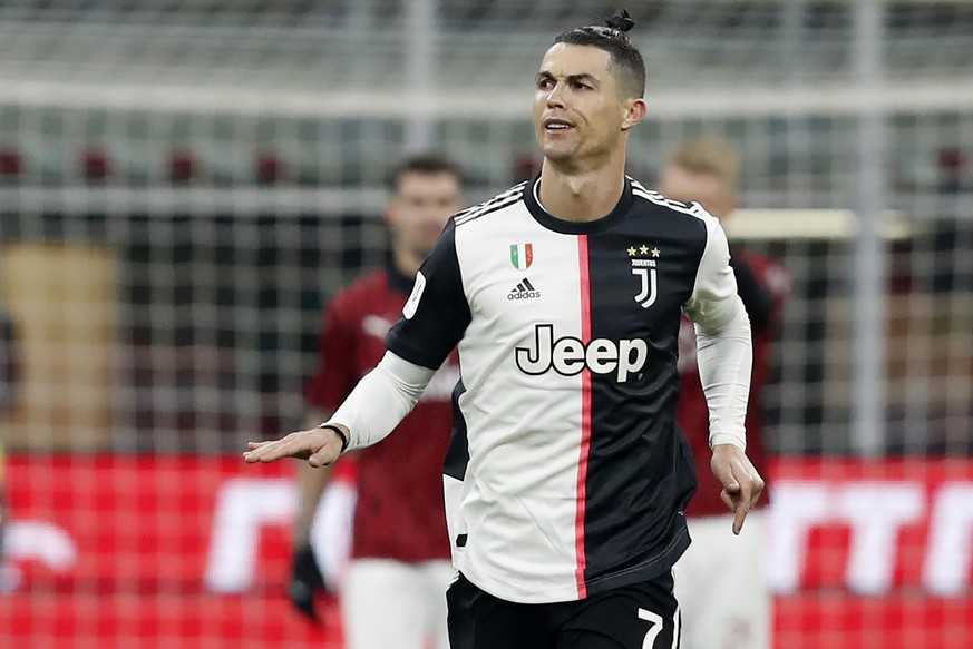Juventus&#039; Cristiano Ronaldo celebrate after scores with penalty against AC Milan during an Italian Cup soccer match between AC Milan and Juventus at the San Siro stadium, in Milan, Italy, Thursda ...