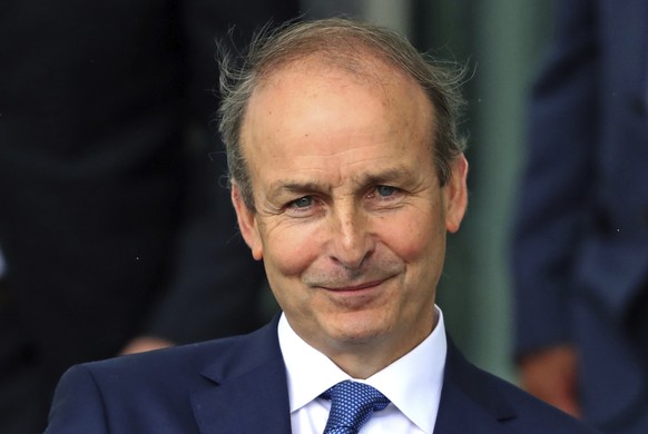 Fianna Fail party leader Micheal Martin leaves the Dail government in Dublin, where he has been officially elected as the new Irish Premier, Saturday June 27, 2020. As part of a pact between Martin an ...