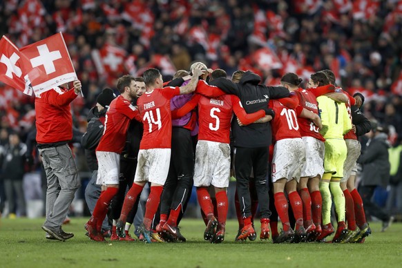 Switzerland&#039;s players celebrate after the 2018 FIFA World Cup play-off second leg soccer match between Switzerland and Northern Ireland in the St. Jakob-Park stadium in Basel, Switzerland, on Sun ...