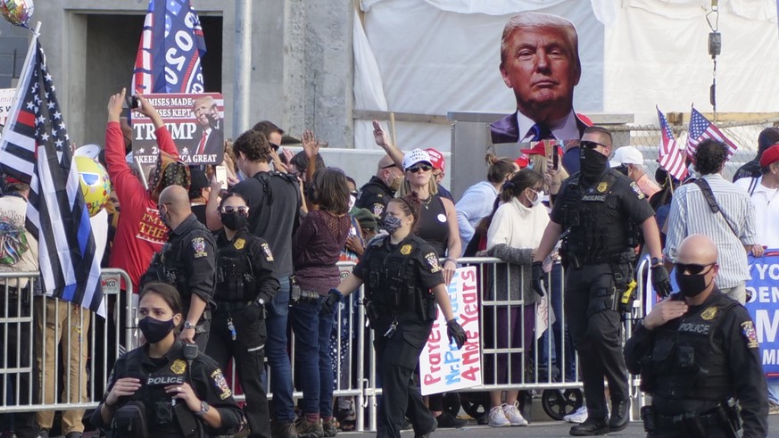 President Donald Trump supporters gather outside Walter Reed National Military Medical Center in Bethesda, Md., Sunday, Oct. 4, 2020. Trump was admitted to the hospital after contracting COVID-19. (AP ...