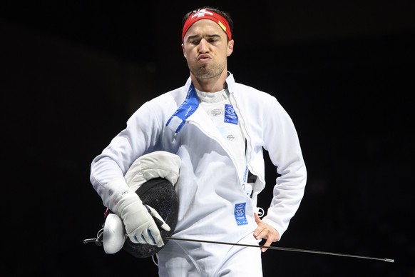 epa09363599 Switzerland&#039;s Max Heinzer looks desapointed after loosing against Ukraine&#039;s Igor Reizlin in the men&#039;s epee fencing individual round of 16 competition during the Fencing even ...