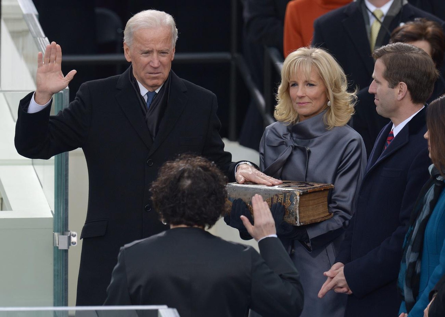 epa03548393 US Vice President Joe Biden (L) places his hand on a bible held by his wife Dr. Jill Biden (C) as he takes the ceremonial oath of office from Supreme Court Justice Sonia Sotomayor (2nd L)  ...