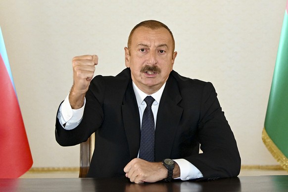 In this photo provided by the Azerbaijan&#039;s Presidential Press Office provided on Sunday, Sept. 27, 2020, Azerbaijani President Ilham Aliyev gestures as he addresses the nation in Baku, Azerbaijan ...