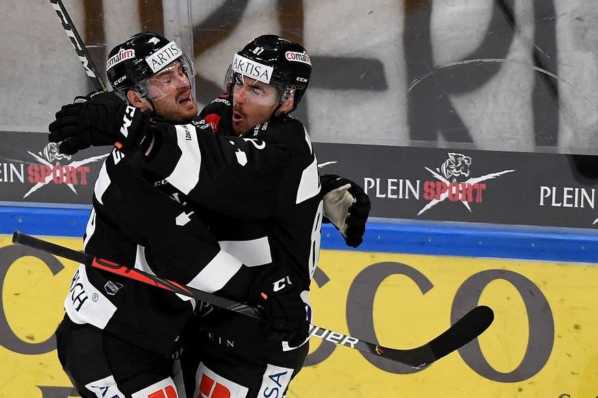 Lugano&#039;s player Dario Buergler right celebrates the 1-0 goal with Lugano&#039;s player Mikkel Boedker left, during the preliminary round game of National League A (NLA) Swiss Championship 2020/21 ...