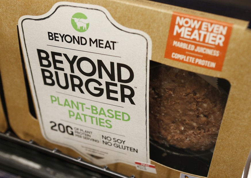 FILE - In this June 27, 2019, file photo a meatless burger patty called Beyond Burger made by Beyond Meat is displayed at a grocery store in Richmond, Va. Beyond Meat reports financial earns Monday, O ...
