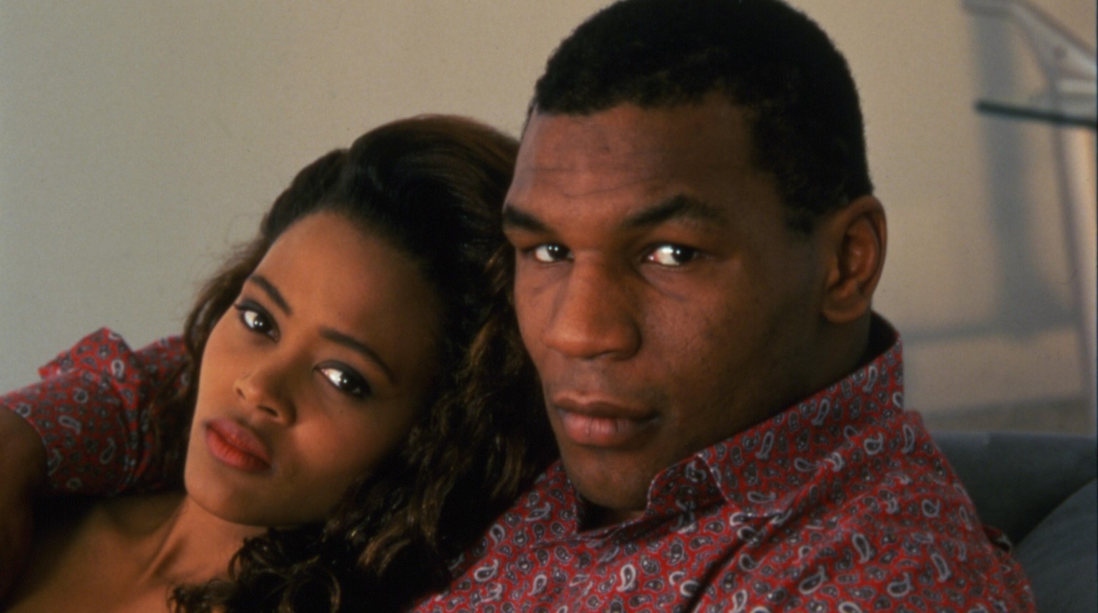 Portrait of American actress Robin Givens and her husband, heavyweight boxer Mike Tyson, as they sit on a sofa, Los Angeles, California, May 1988. (Photo by Anthony Barboza/Getty Images)