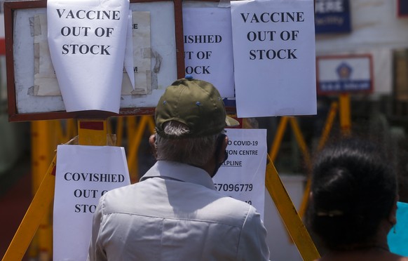 A notice informing about the shortage of COVID-19 vaccine is displayed on the gate of a vaccination centre in Mumbai, India, Tuesday, April 20, 2021. India has decided to vaccinate everyone above 18 f ...