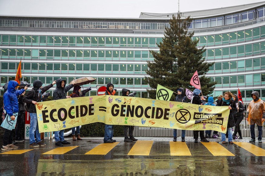 epa08224088 Following up on several protests in Geneva and Lausanne on the same day, activists from the global environmental movement Extinction Rebellion, XR, march to stage a protest in front of the ...