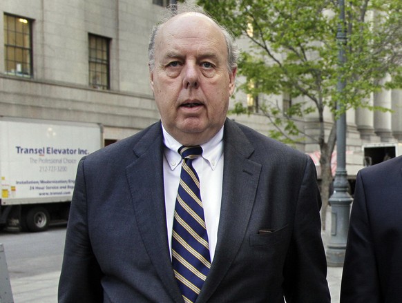 FILE - In this April 29, 2011, file photo, attorney John Dowd walks in New York. One of President Donald Trump’s attorneys floated the possibility of pardoning two of the president’s former advisers c ...