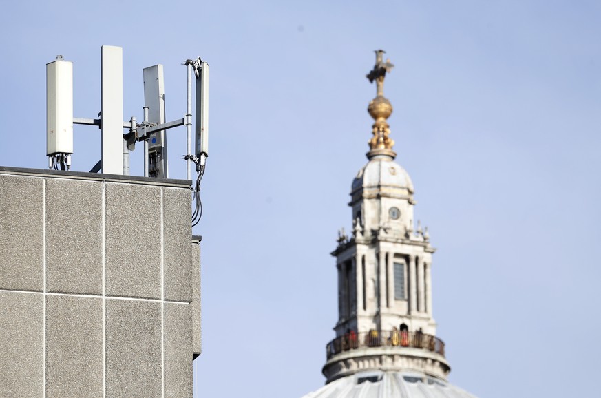 Mobile network phone masts are visible in front of St Paul&#039;s Cathedral in the City of London, Tuesday, Jan. 28, 2020. The Chinese tech firm Huawei has been designated a &quot;high-risk vendor&quo ...