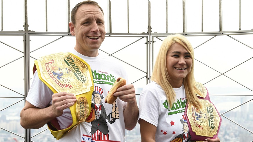 Eleven-time and defending men&#039;s champion Joey Chestnut, left, and defending women&#039;s champion Miki Sudo pose together during Nathan&#039;s Famous international Fourth of July hot dog eating c ...