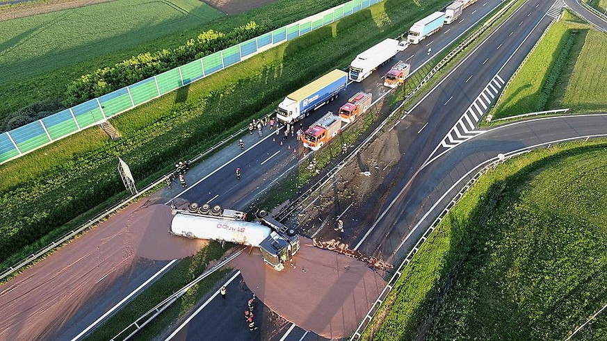 epa06721242 A tractor-trailer carrying liqiud chocolate has overturned on a Polish A2 highway in central Poland, 09 May 2018. The chocolate coveed six lanes on the A2 motorway, blocking traffic in bot ...