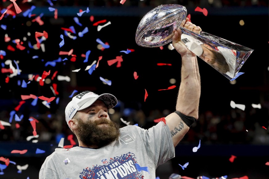 epa07341745 Super Bowl LIII MVP New England Patriots wide receiver Julian Edelman holds the Vince Lombardi Trophy after Super Bowl LIII between the New England Patriots and the Los Angeles Rams at Mer ...
