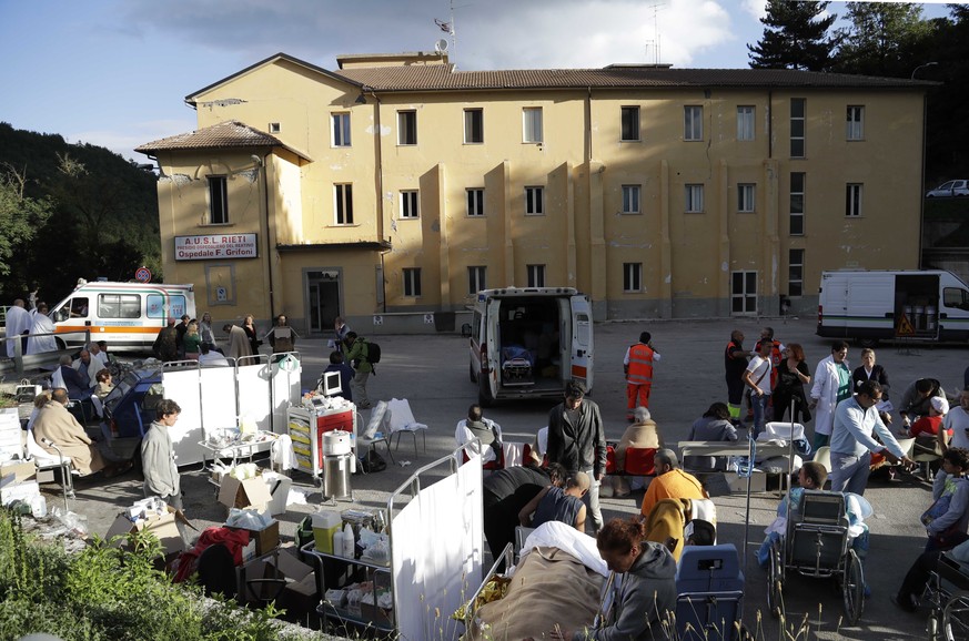 A makeshift medical camp is set up outside a hospital following an earthquake, in Amatrice, Italy, Wednesday, Aug. 24, 2016. The magnitude 6 quake struck at 3:36 a.m. (0136 GMT) and was felt across a  ...