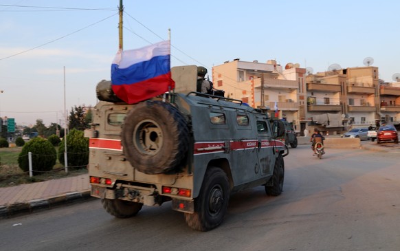 epa07953364 Russian military police forces patrol an area at Qamishli, northern Syria, 26 October 2019 (issued on 27 October 2019). Media reports state Russian military police began patrols on part of ...