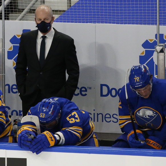 Buffalo Sabres head coach Ralph Krueger, top center, looks on during the third period of an NHL hockey game against the Pittsburgh Penguins, Saturday, March 13, 2021, in Buffalo, N.Y. (AP Photo/Jeffre ...