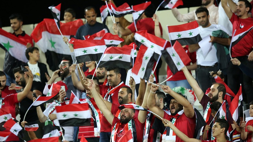 epa07265594 Syrian fans attend the 2019 AFC Asian Cup group B preliminary round match between Syria and Palestine in Sharjah, United Arab Emirates, 06 January 2019. EPA/MAHMOUD KHALED