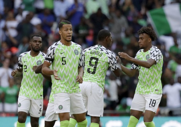 Nigeria&#039;s Alex Iwobi, right, celebrates with teammates after scoring his side&#039;s opening goal during a friendly soccer match between England and Nigeria at Wembley stadium in London, Saturday ...
