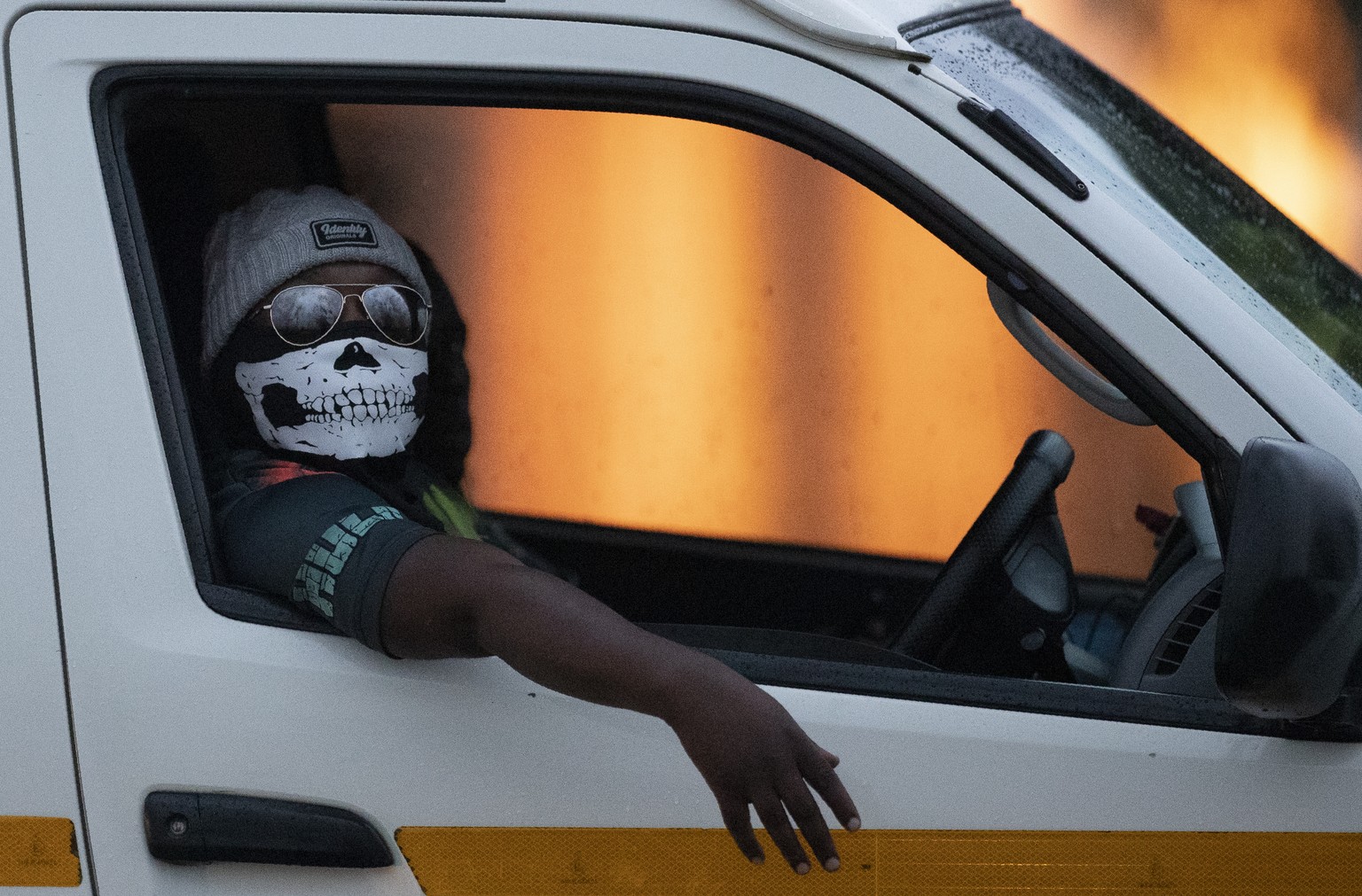 A minibus taxi driver wearing a face musk looks on during his journey in Kwa-Thema east of Johannesburg, South Africa, Tuesday, March 17, 2020. President Cyril Ramaphosa said all schools will be close ...