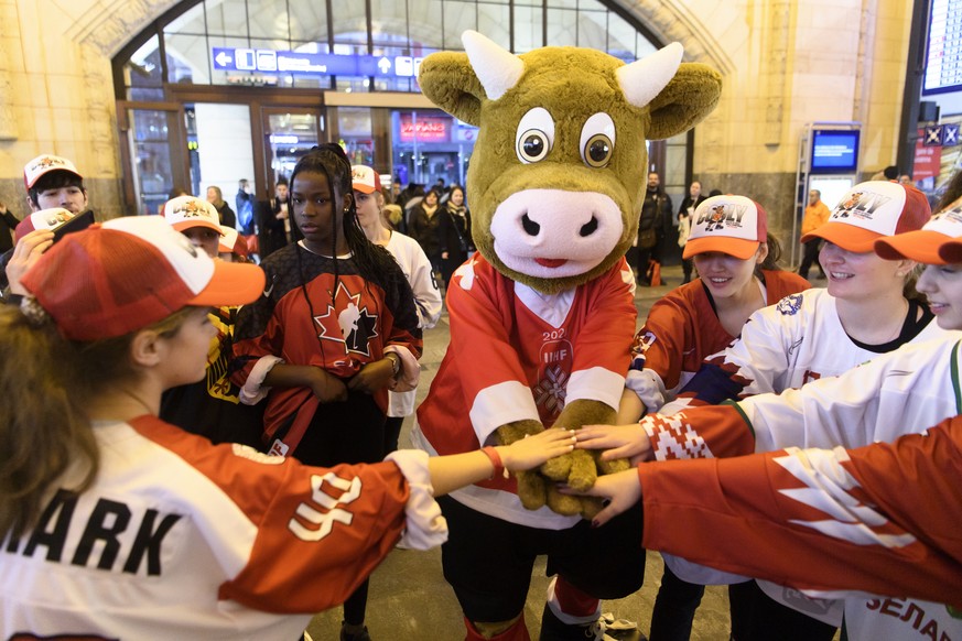 Cooly, the official mascot of the 2020 IIHF Ice Hockey World Championship dance with kids during a flashmob 100 days before the 2020 IIHF Ice Hockey World Championship at the CFF train station, in Lau ...