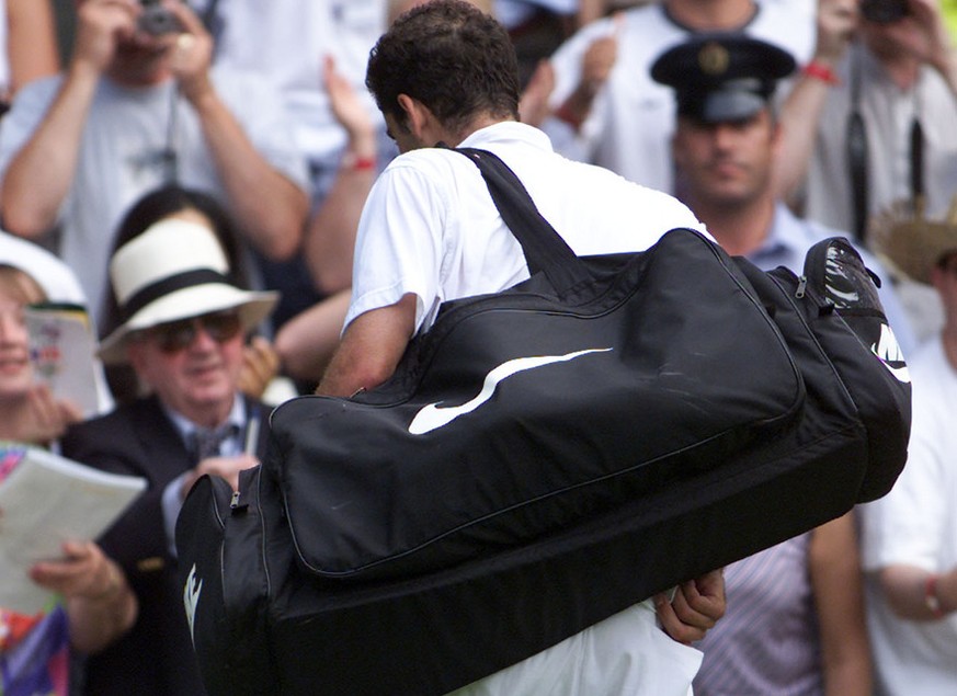 Pete Sampras leaves Wimbledon&#039;s Centre Court, Monday July 2, 2001, following his defeat by Roger Federer of Switzerland. Federer, defeated Sampras, the defending champion, 7-6 (9-7), 5-7, 6-4, 6- ...