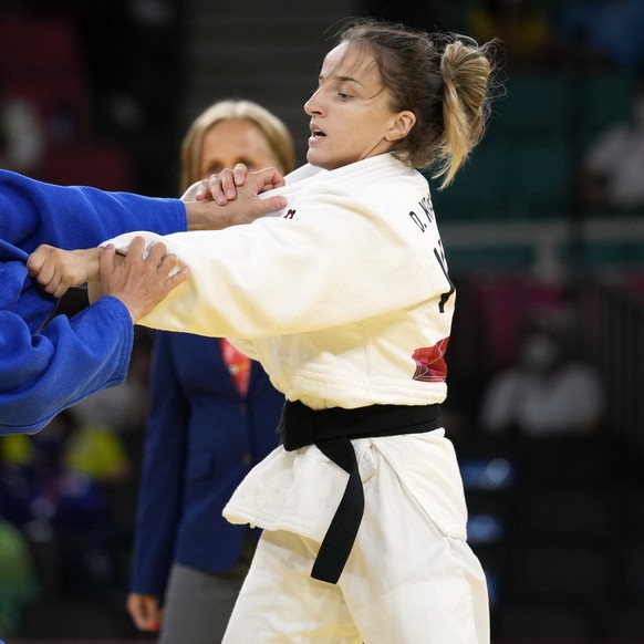 Urantsetseg Munkhbat of Mongolia, left, and Distria Krasniqi of Kosovo compete during their women&#039;s -48kg semifinal judo match at the 2020 Summer Olympics, Saturday, July 24, 2021, in Tokyo, Japa ...