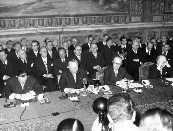 FILE - In this March 25, 1957 file photo, seated from left to right are: French Foreign Undersecretary Maurice Faure, German Chancellor Konrad Adenauer, German Foreign Affairs Underseretary Walter Hal ...