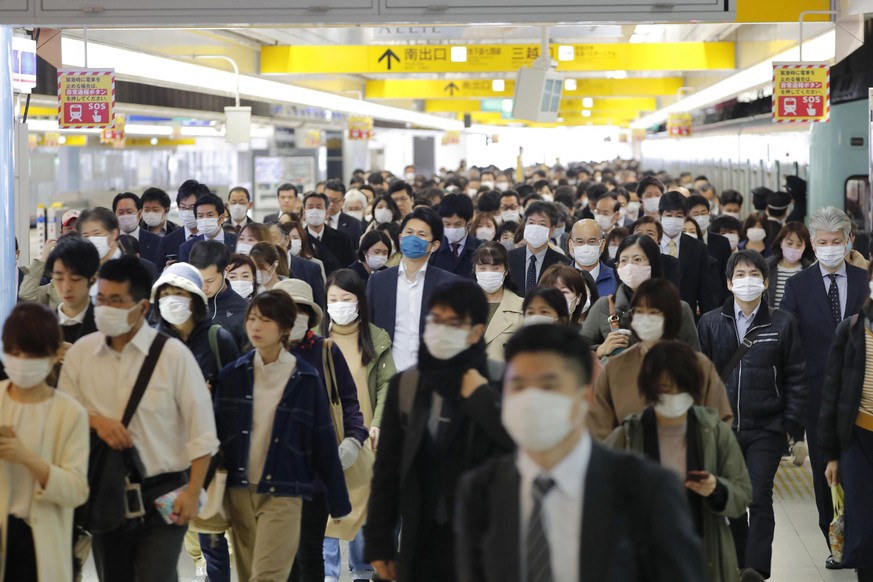 Commuters wear masks at a station in Fukuoka, southern Japan Wednesday morning, April 8, 2020. JapanÄôs Prime Minister Shinzo Abe declared a month-long state of emergency Tuesday for Tokyo and six ot ...
