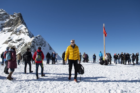 epa08827130 Tourists enjoy the autumn weather and the clear view on the observation deck 3,454 meters above sea level at the Jungfraujoch (the Jungfrau saddle) above the Aletsch glacier near Interlake ...