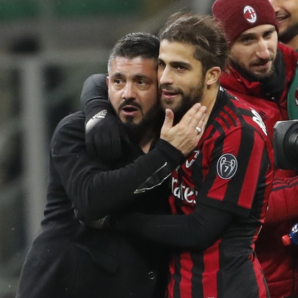AC Milan coach Gennaro Gattuso embraces AC Milan&#039;s Ricardo Rodriguez, who missed a penalty kick, at the end of an Italian Serie A soccer match between AC Milan and Sampdoria, at the San Siro stad ...