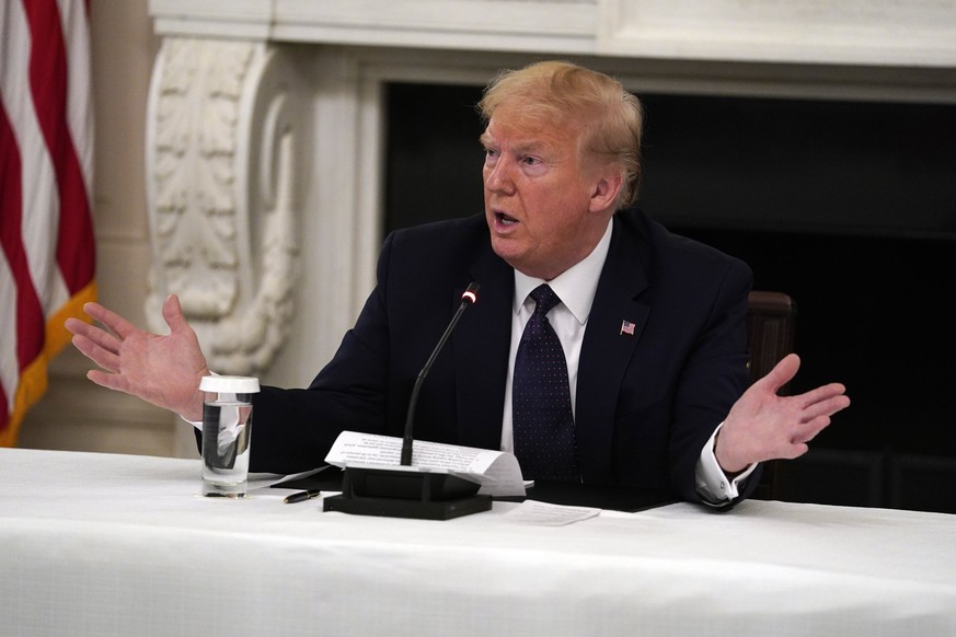 FILE - In this May 18, 2020 file photo, President Donald Trump tells reporters that he is taking zinc and hydroxychloroquine during a meeting with restaurant industry executives about the coronavirus  ...