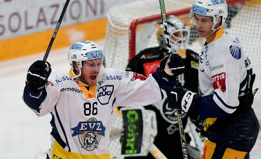 Zug&#039;s player Erik Thorell, left, celebrates the 0-2 goal, during the preliminary round game of National League Swiss Championship between HC Lugano and EV Zug, at the Corner Arena stadium in Luga ...