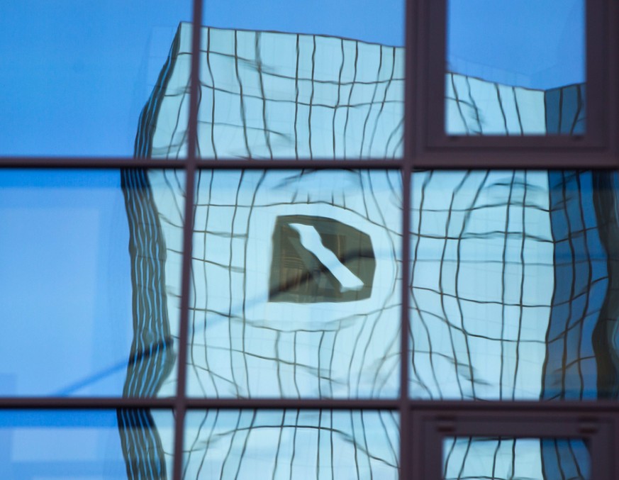 epa05563335 (FILE) A file photo dated 21 May 2015 showing the reflection of the Deutsche Bank logo contorted in a glass facade in Frankfurt, Germany. Deutsche Bank shares on 30 September 2016 plummete ...