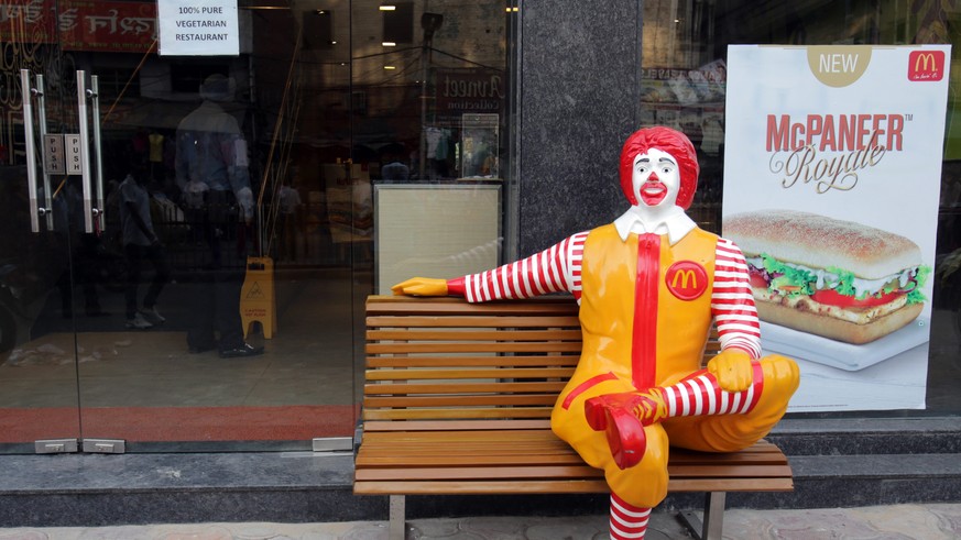epa04164473 A &#039;Ronald McDonald&#039; figure sits on a bench outside the newly opened, McDonald&#039;s first ever vegetarian-only restaurant near the Golden Temple (not pictured), the holiest of S ...