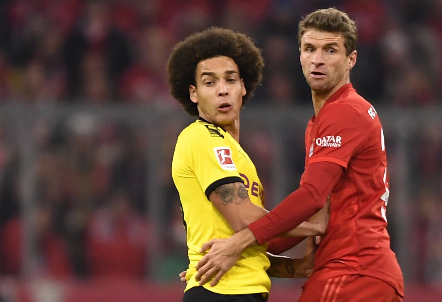epa08323717 (FILE) - A file picture of Dortmund&#039;s Axel Witsel (L) and Bayern&#039;s Thomas Mueller (R) in action during the German Bundesliga soccer match between FC Bayern Munich and Borussia Do ...