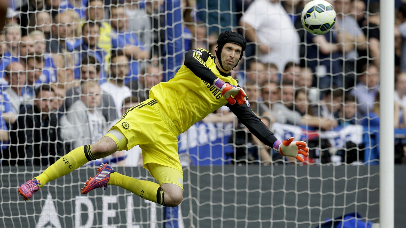 FILE - In this Sunday, May 24, 2015 file photo, Chelsea&#039;s goalkeeper Petr Cech makes a save during the English Premier League soccer match between Chelsea and Sunderland at Stamford Bridge stadiu ...
