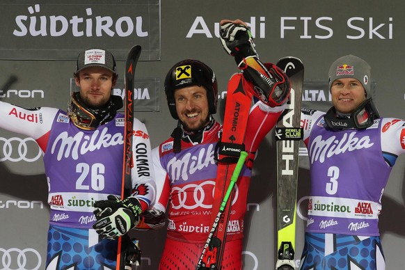 epa07237613 Second placed Thibaut Favrot (L) of France, winner Marcel Hirscher (C) of Austria and third placed Alexis Pinturault (R) of France celebrate on the podium of the men&#039;s Parallel Giant  ...