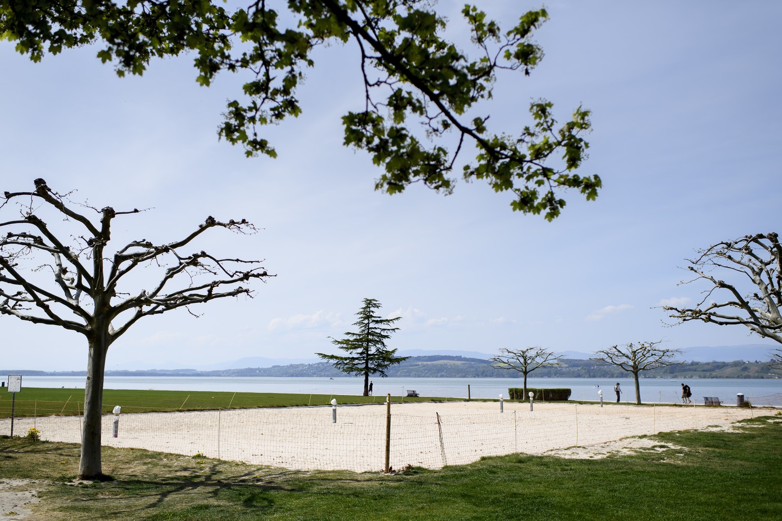 A closed beach volleyball court on the shore of Lake Murten during the state of emergency of the coronavirus disease (COVID-19) outbreak, in Murten, Switzerland, Monday, April 13, 2020. Countries arou ...