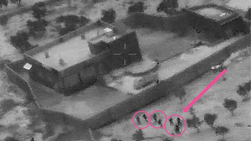 epa07961150 A screengrab from a handout military drone video made available by the US Defense Video and Imagery Distribution System (DVIDS) shows the compound of ISIS Leader Abu Bakr al-Baghdadi durin ...