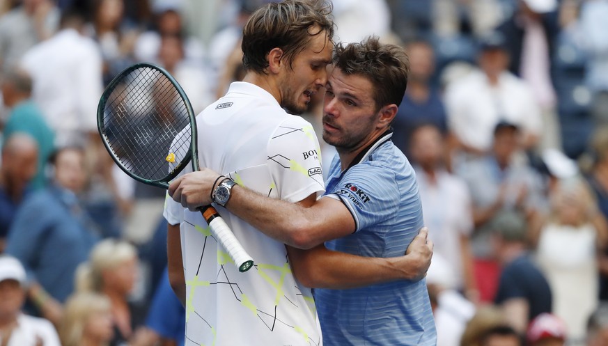 epa07815595 Daniil Medvedev of Russia (L) and Stan Wawrinka of Switzerland after their quarter-finals round match on the ninth day of the US Open Tennis Championships the USTA National Tennis Center i ...