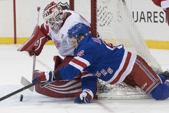 Detroit Red Wings goaltender Jimmy Howard (35) makes the save against New York Rangers center Vinni Lettieri (95) during the second period of an NHL hockey game, Tuesday, March 19, 2019, at Madison Sq ...