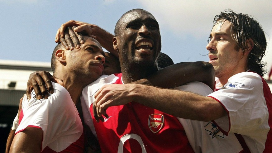 Arsenal&#039;s Thierry Henry (left) celebrates his first goal equaliser against Liverpool with team-mates Sol Campbell (centre) and Robert Pires during the Barclaycard Premiership match at Highbury, n ...