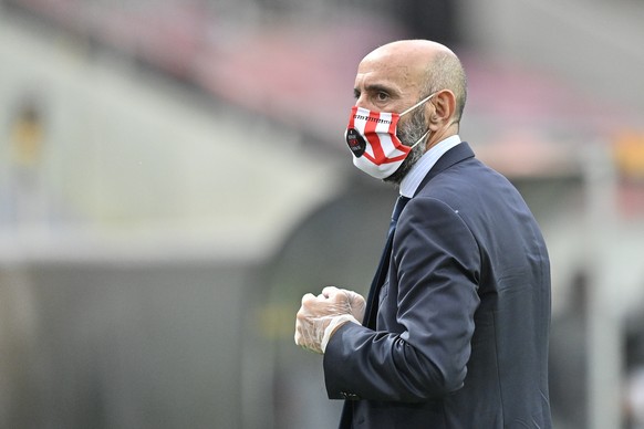 Sevilla sports director Monchi wears protective gloves and mask prior to the start of an Europa League semifinal match between Sevilla and Manchester United, in Cologne, Germany, Sunday, Aug. 16, 2020 ...