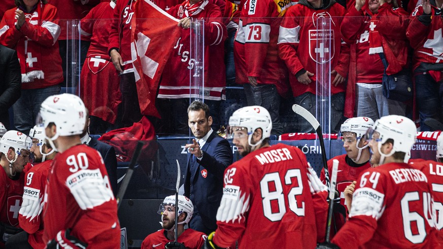 Switzerland`s coach Patrick Fischer celebrates with the team after scoring 2:0 during the game between Switzerland and Austria, at the IIHF 2019 World Ice Hockey Championships, at the Ondrej Nepela Ar ...