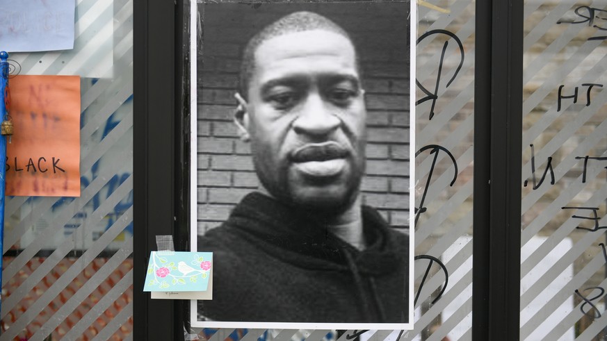 epa08453025 An image of George Floyd is on display at a makeshift memorial near the scene of the arrest of Floyd who died in police custody in Minneapolis, Minnesota USA, 29 May 2020. Floyd&#039;s lif ...