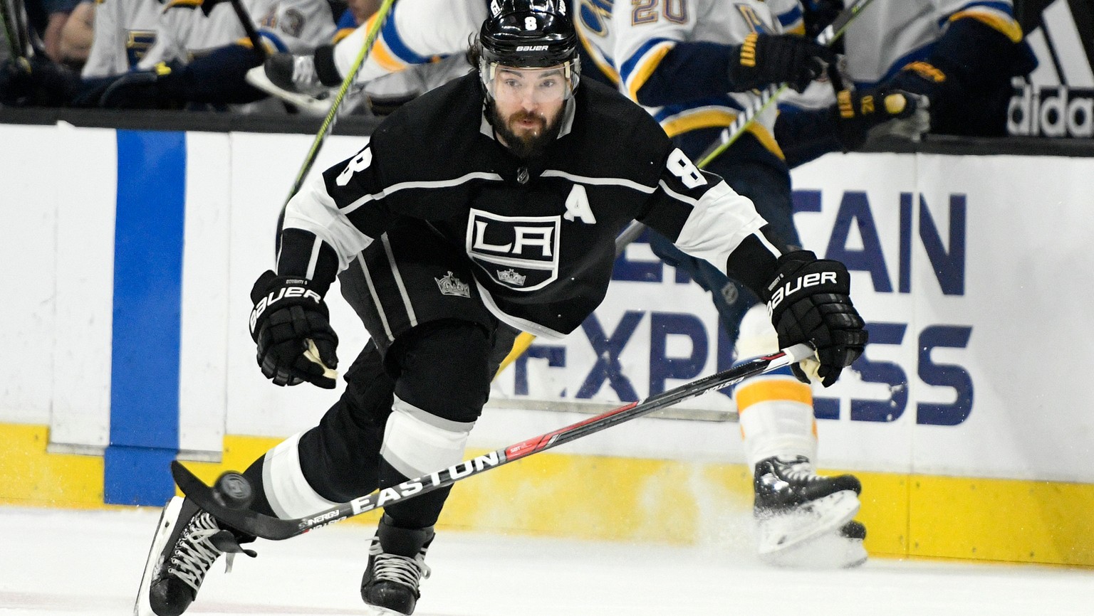 FILE - In this March 10, 2018, file photo, Los Angeles Kings defenseman Drew Doughty (8) brings the puck up the ice against St. Louis Blues during an NHL hockey game in Los Angeles. Through the first  ...