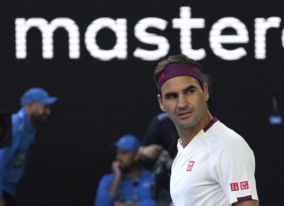Switzerland&#039;s Roger Federer reacts after defeating Tennys Sandgren of the U.S. in their quarterfinal match at the Australian Open tennis championship in Melbourne, Australia, Tuesday, Jan. 28, 20 ...